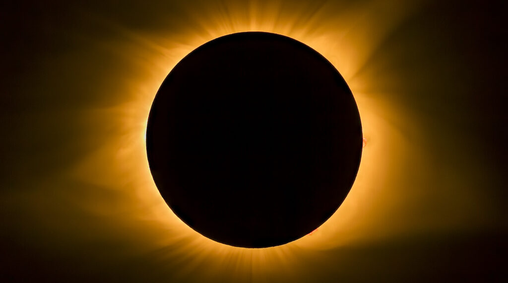 The moon covers the sun and displays the star's corona during totality. Photographed in Cerulean, Kentucky during the Total Eclipse of August 21, 2017.