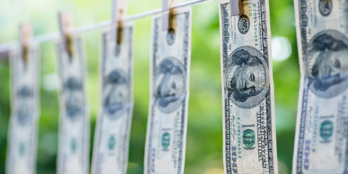 Money Laundering. Money Laundering US dollars hung out to dry. 100 dollar bills hanging on clotheslines