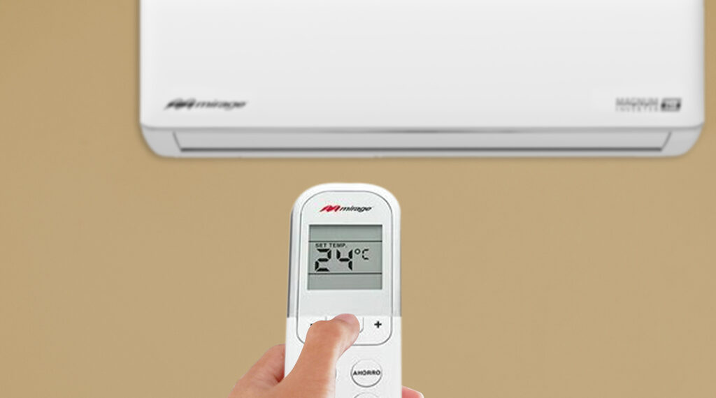 Women hand using remote control the air conditioner is cooled to 25 degrees Celsius for energy saving.