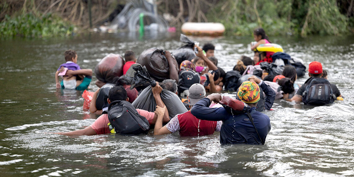 MATAMOROS, MEXICO - MAY 11: Migrants swim across the Rio Grande as they try to enter the United States on May 11, 2023 in Matamoros, Mexico. A surge of migrants is expected with the end of the U.S. government's Covid-era Title 42 policy, which for the past three years has allowed for the quick expulsion of irregular migrants entering the country.   Joe Raedle/Getty Images/AFP (Photo by JOE RAEDLE / GETTY IMAGES NORTH AMERICA / Getty Images via AFP)