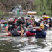 MATAMOROS, MEXICO - MAY 11: Migrants swim across the Rio Grande as they try to enter the United States on May 11, 2023 in Matamoros, Mexico. A surge of migrants is expected with the end of the U.S. government's Covid-era Title 42 policy, which for the past three years has allowed for the quick expulsion of irregular migrants entering the country.   Joe Raedle/Getty Images/AFP (Photo by JOE RAEDLE / GETTY IMAGES NORTH AMERICA / Getty Images via AFP)
