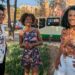 De izquierda a derecha, Joseline Morales, Kathleen Murrain y Gladys de León, retratadas frente a un mural con los Objetivos de Desarrollo Sostenible de la ONU y una niña afrodescendiente, en la Alcaldía de Iztapalapa, en la Ciudad de México.